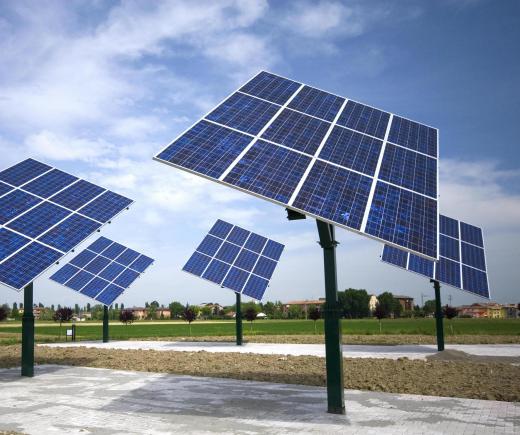 An array of solar panels pointed at the sun.